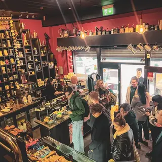 The queue along the counter, seen from just inside the front door